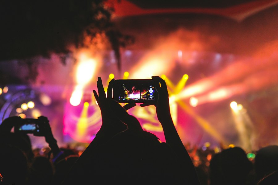 Guest photographing a stage on a phone